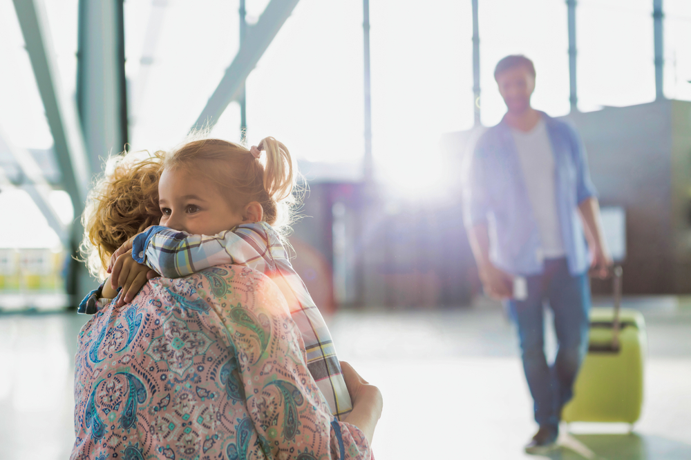 Portrait of woman reuniting with her daughter in airport after international travel ban comes to an end, November 2021