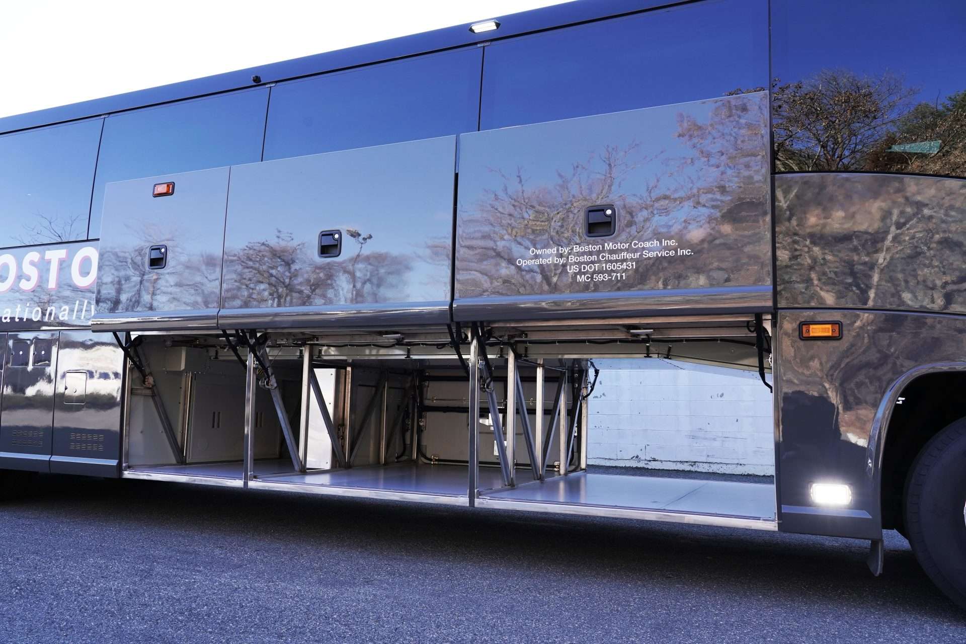 A view of Boston Chaufeur's 56 Passenger Bus luggage area under the bus.